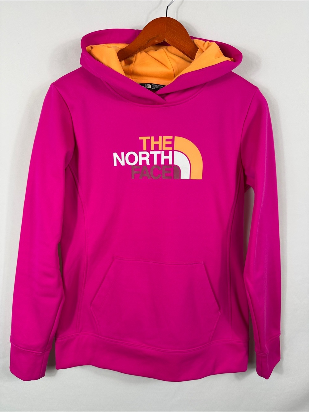 The North Face Hot Pink Hoodie with Yellow Orange Hood Lining. Womens Size M